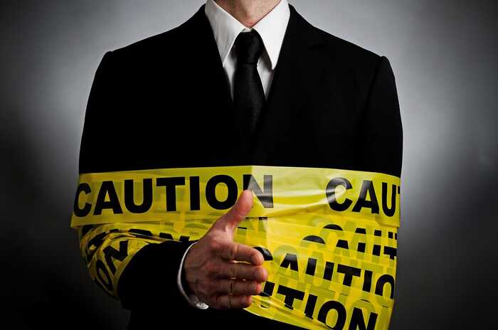 Manager wrapped in Caution tape