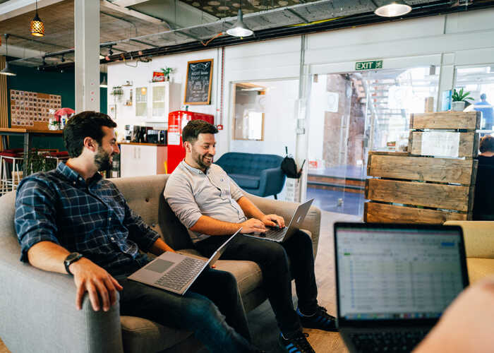 Sonder staff members working on a PPC project in office setting